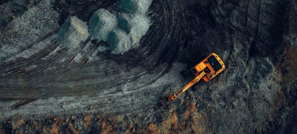 Excavator,At,Work,On,A,Dark,Background.,Top,View,From